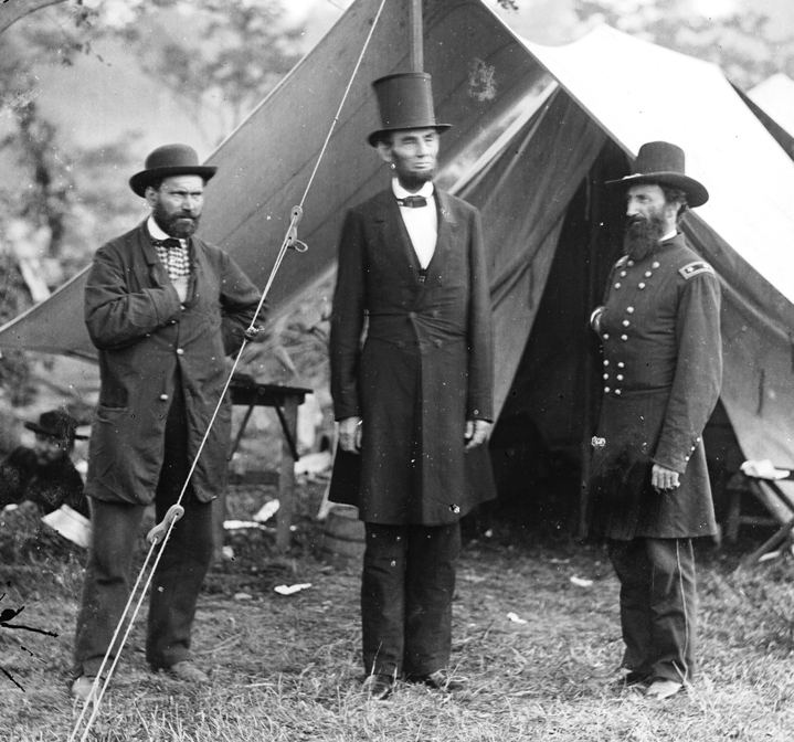 Abraham Lincoln (middle) in his stovepipe silk hat at Antietam, 1862
