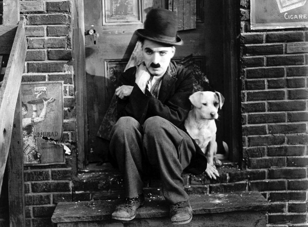 Charlie Chaplin in bowler hat, a still for his 1915 film, The Tramp